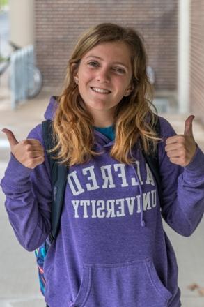 Saxon Student wearing purple hoodie